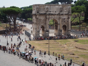 Crowds queueing to enter the Colosseum in Rome. 12 Euro tickets are valid for 2 days for visitors to explore, The Palatine Hill, The Forum and The Colosseum itself plus 3 onsite museums.